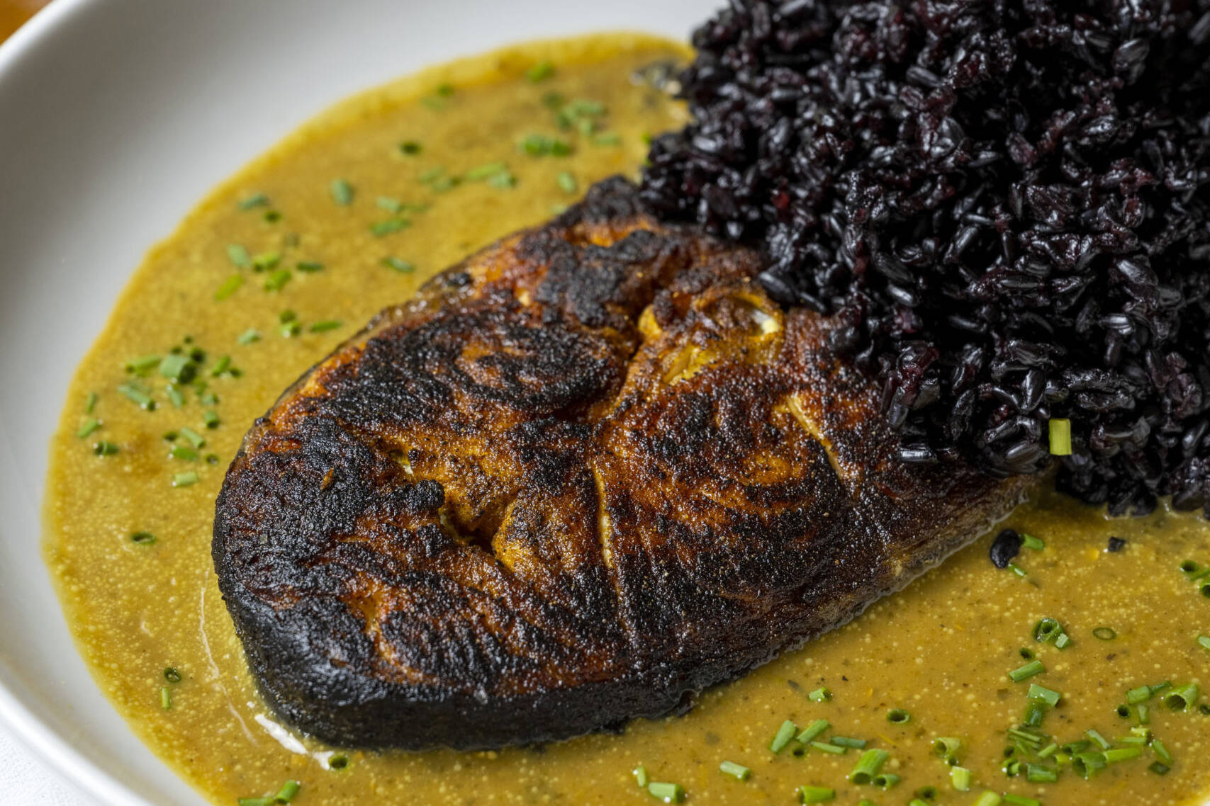 Coconut curry salmon with black rice at Sesamo, Hell's Kitchen NYC