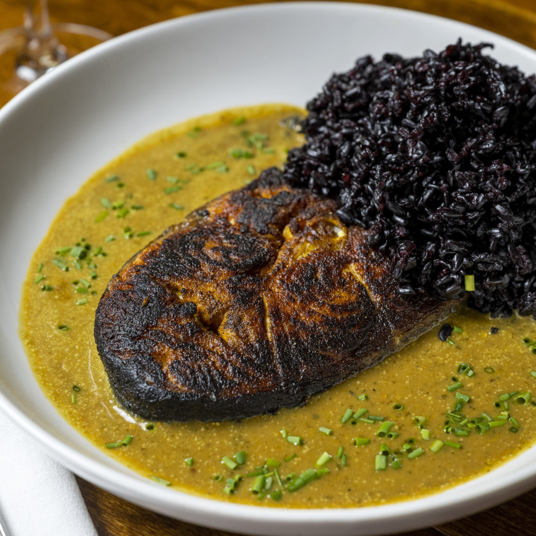 Coconut curry salmon with black rice at Sesamo, Hell's Kitchen NYC